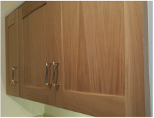 Oak utility kitchen with fitted cupboards.