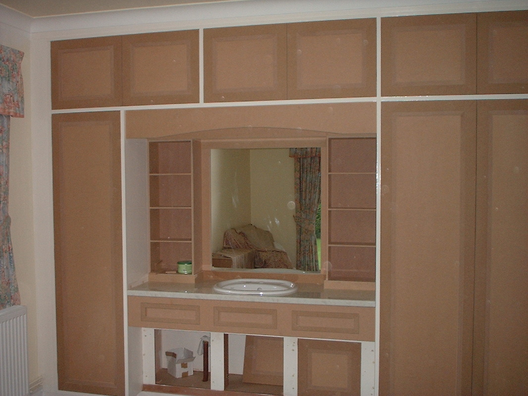 Large wardrobe with integrated vanity refurb.